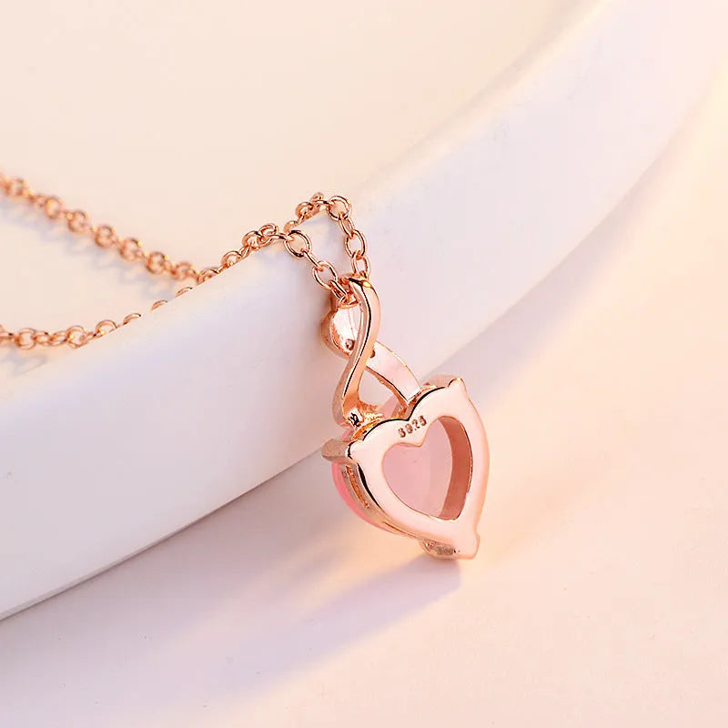 Women's heart-shaped pink artificial crystal pendant necklace with rose gold cross chain