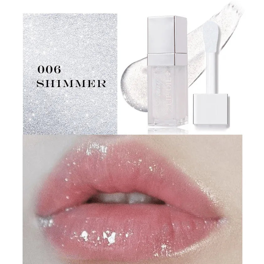 Mint lip essence oil tube in one of five bright colours, shown as a dual-use lip gloss and lipstick.