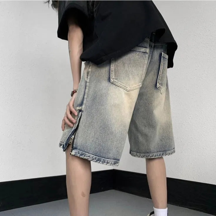 Blue retro denim shorts with tattered detailing and a wide leg loose fit