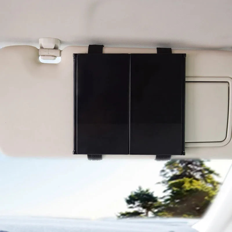 Silver car folding makeup mirror shown both closed at 15.5cm and open at 30.5cm wide.