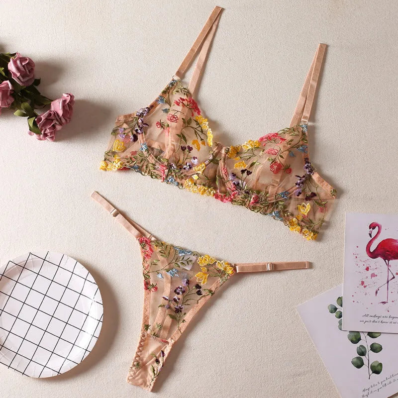 Floral mesh bra and matching T-back briefs set with a steel ring detail, shown in skin colour.