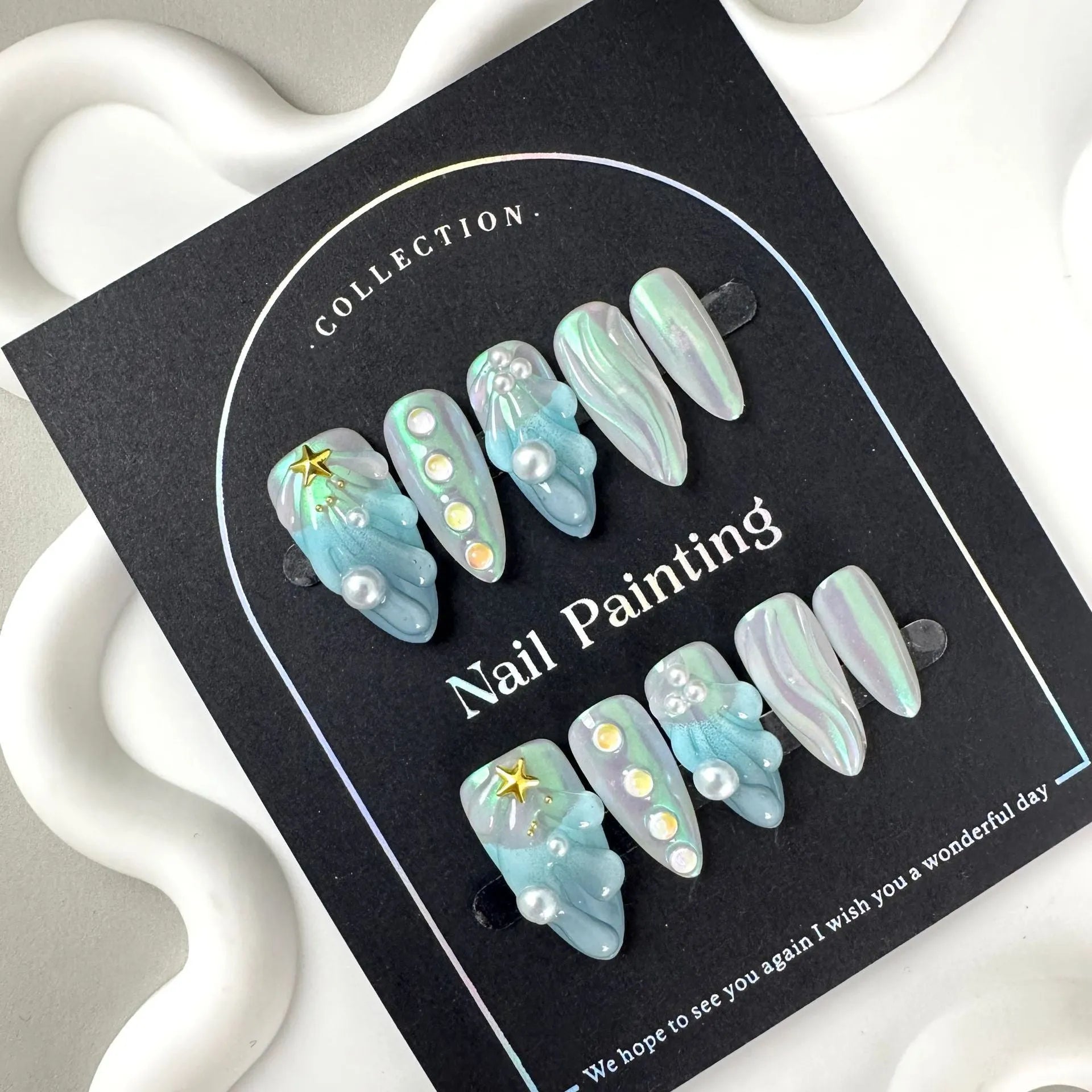 Blue plastic false nail shells for women in XS, S, M, and L sizes.