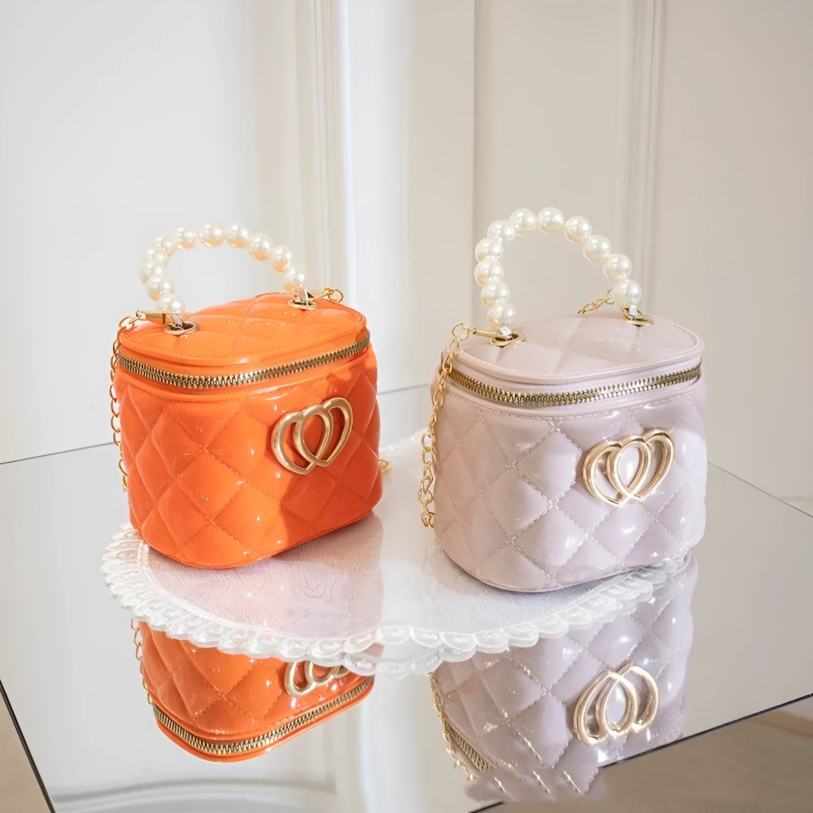 White PVC bucket-shaped cosmetic bag with a red heart pattern, zipper open.