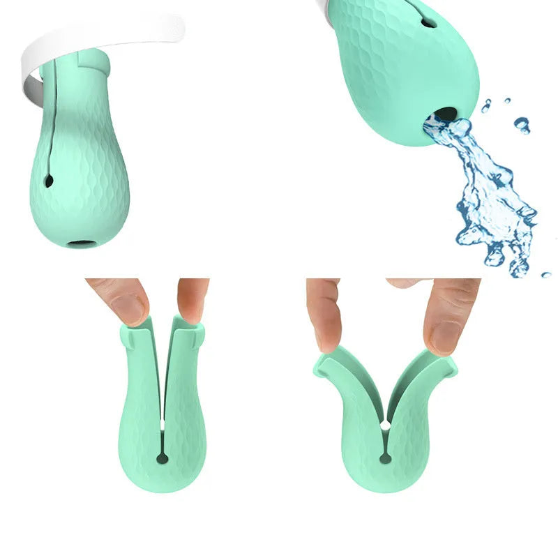 Set of four green silicone cat anti-scratch foot covers or gloves for pet handling.