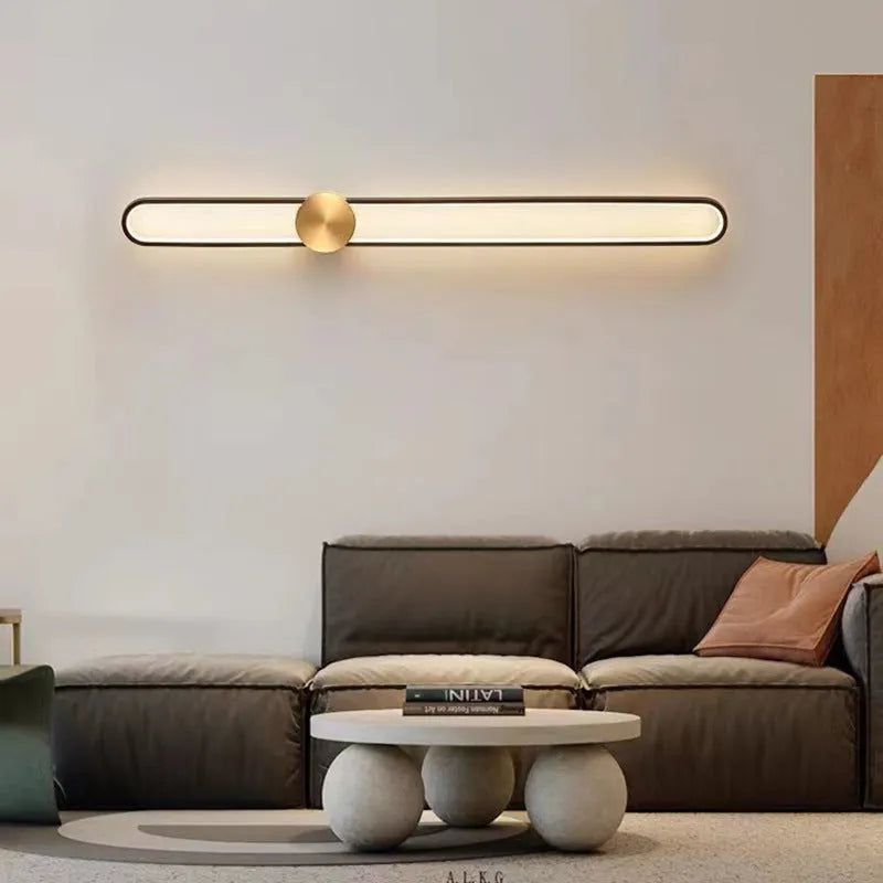 Round 60cm modern wall lamp with iron shade in black or gold frame finish.