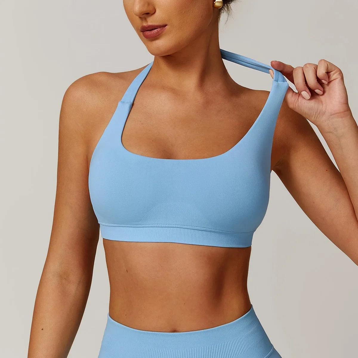 Women's halter neck yoga bra in plum purple colour with removable chest pads