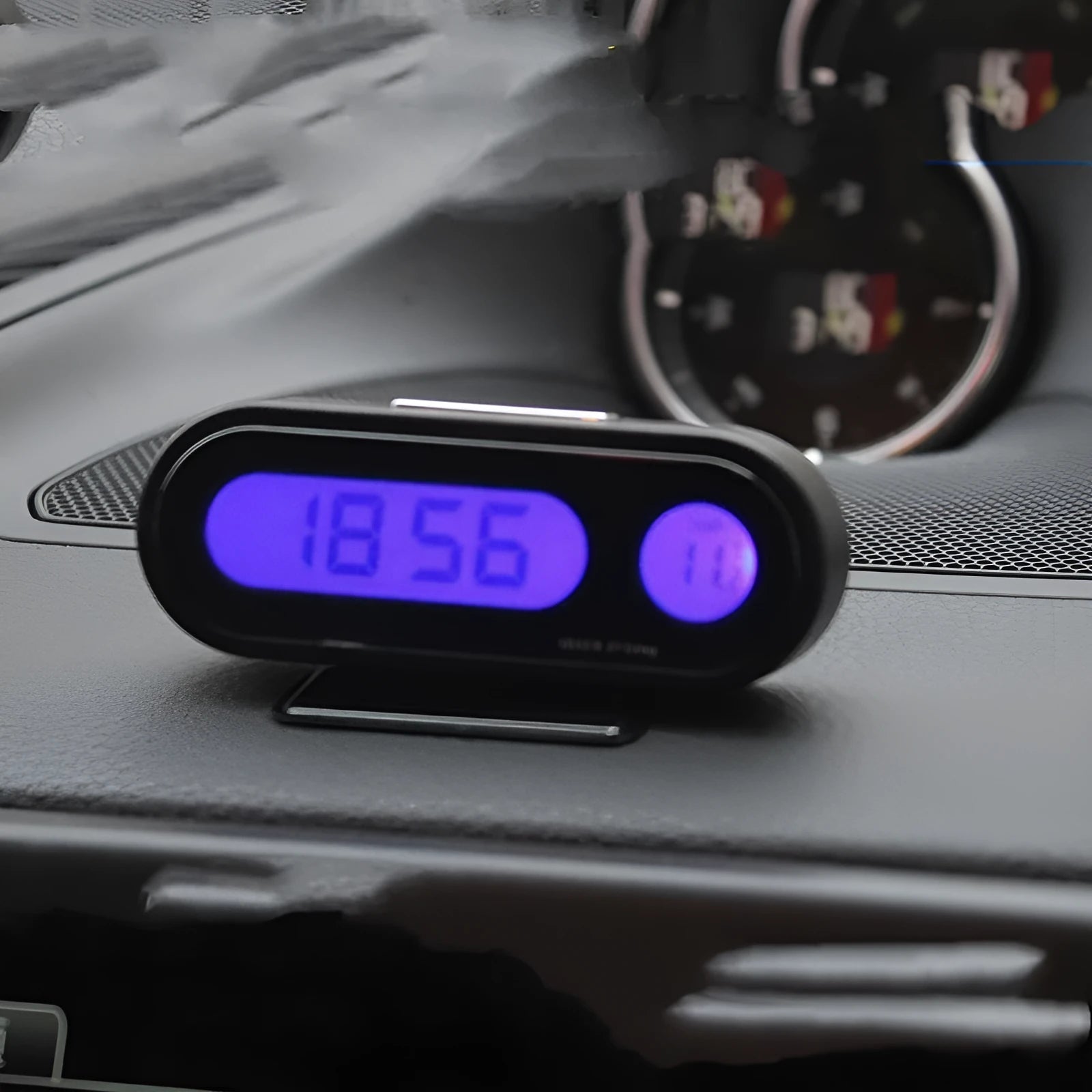 Black digital car clock and thermometer with LED display on adjustable stand
