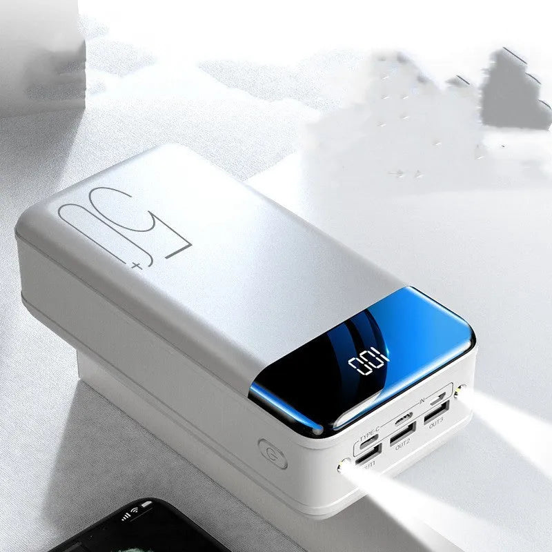 Large 50000mAh power bank with three USB ports in black or white plastic case