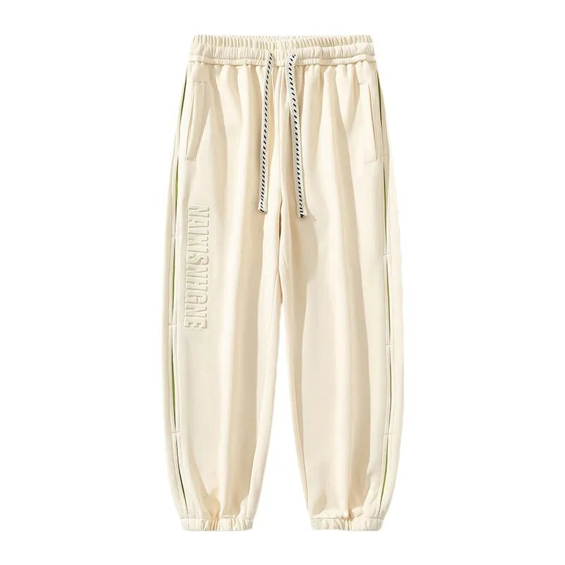 Men's loose cotton trousers with stitching printing design and ankle banded cuffs in black colour