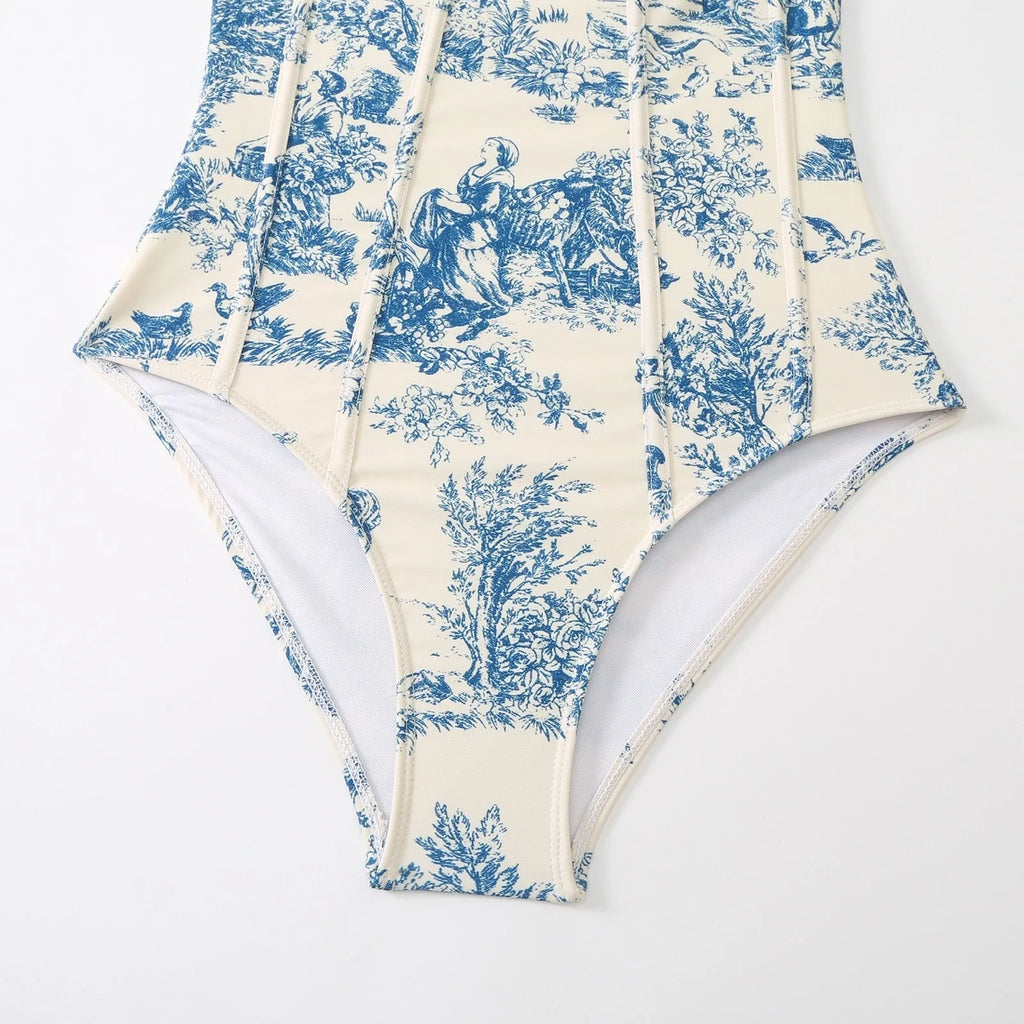 Women's blue patterned one-piece swimsuit with a skirt, made from polyester fabric.
