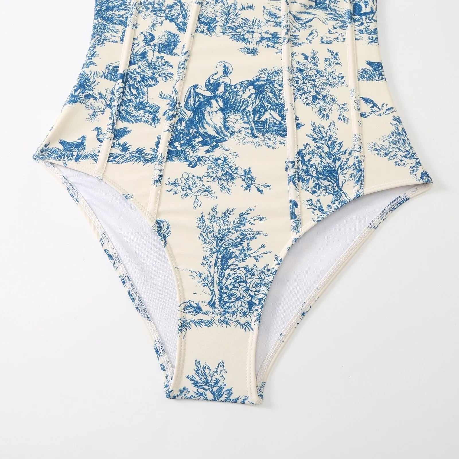 Women's blue patterned one-piece swimsuit with a skirt, made from polyester fabric.