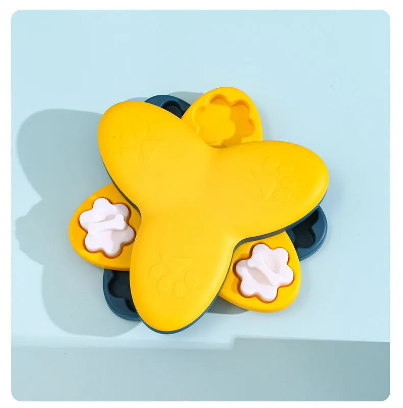 Green and yellow interactive dog puzzle toy with rotatable compartments and bone-shaped covers