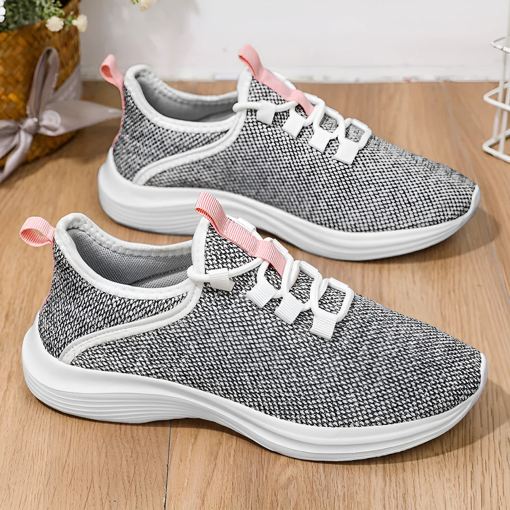 Women's breathable mesh casual sneaker in black with round toe and lace-up front