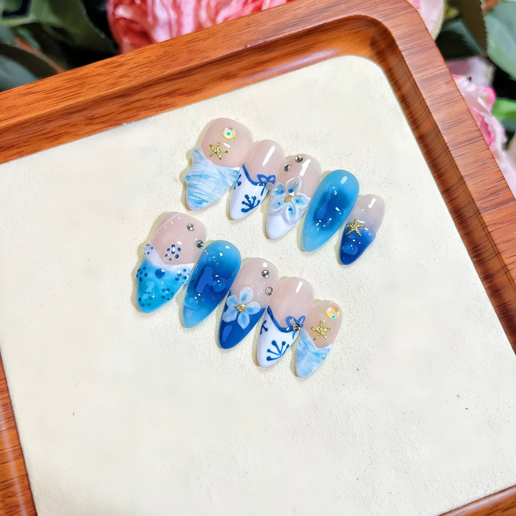 Blue hand-painted carved summer ice transparent plastic fake nails in four sizes XS S M L