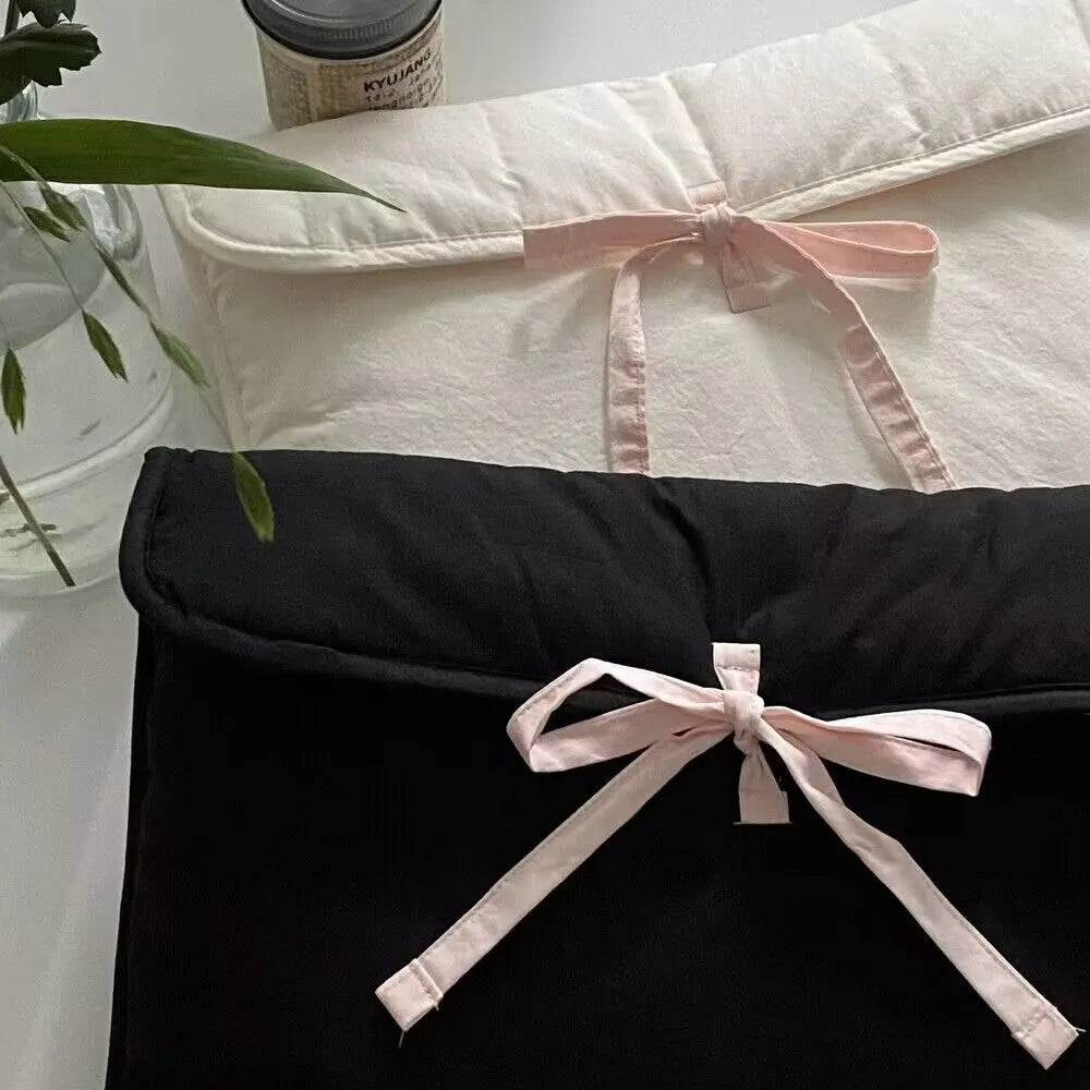 Black and white quilted nylon laptop bag for women with a ballet bow and striped pattern.