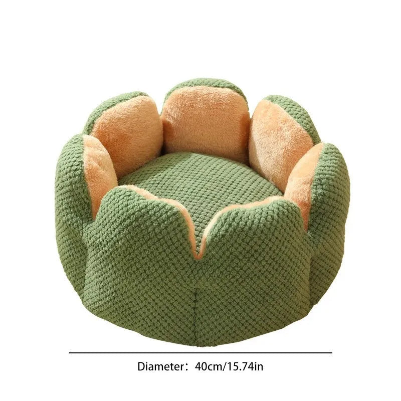 Grey petal-shaped plush kennel bed for cats and dogs on a hardwood floor.