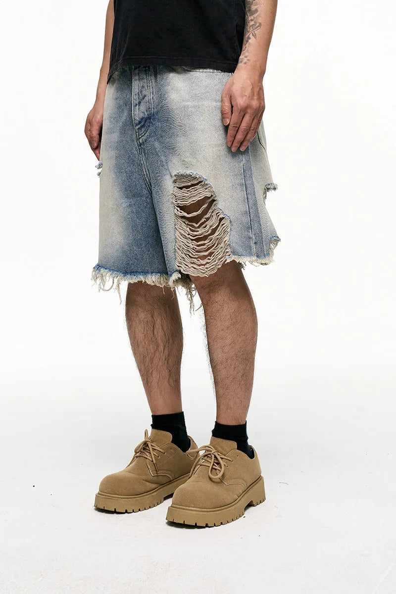 Men's light blue baggy denim shorts with a retro washed finish on a mid-waist