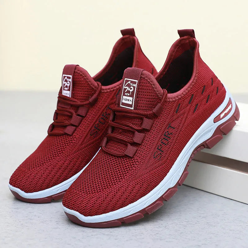 Low-top casual sneakers with a round toe and PVC sole, shown in available colours for men and women.