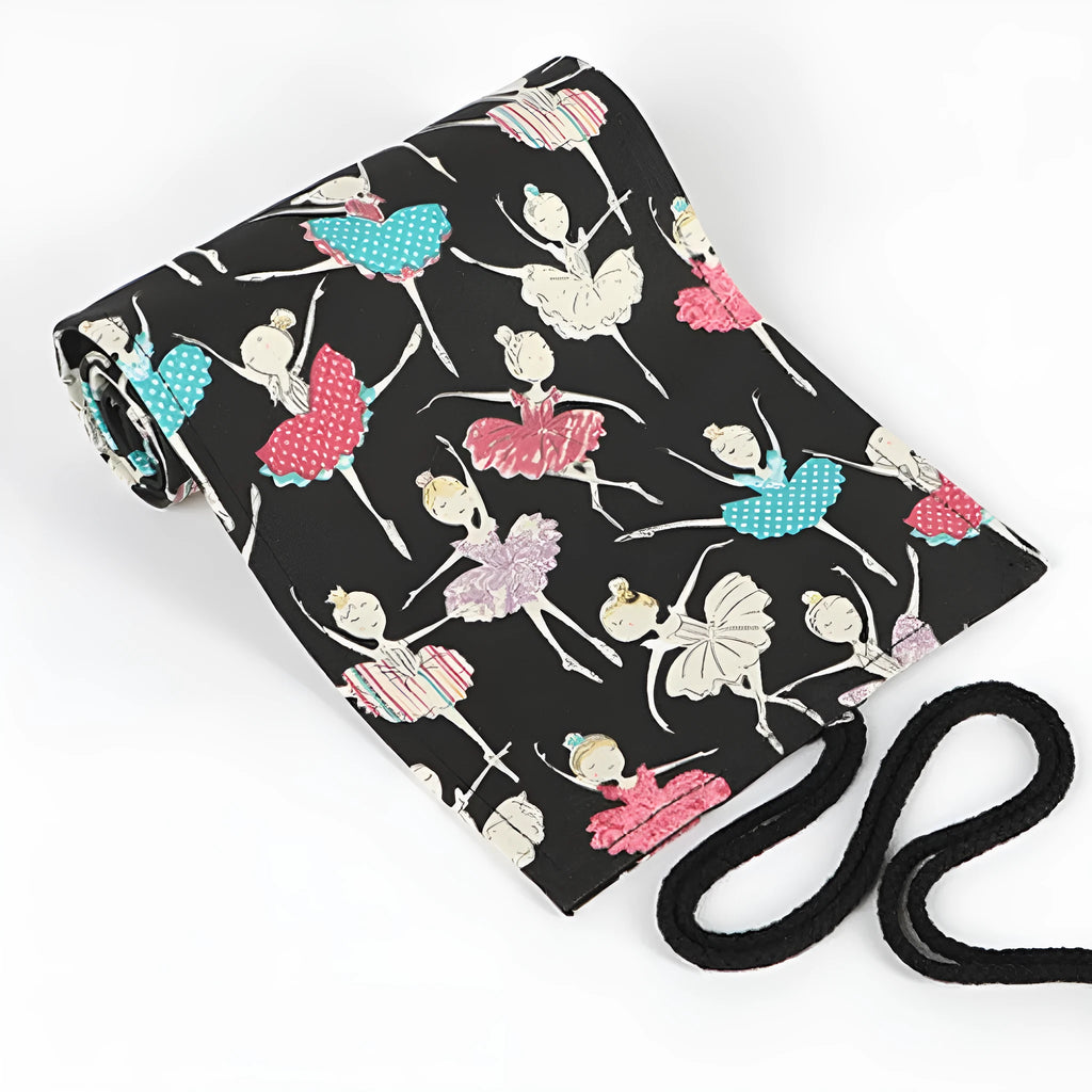Canvas rolling pencil case with ballet girl print, showing multiple holes for pencils in a rolled-open state.
