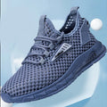 Men's beige casual sneaker with mesh lining, synthetic leather upper, and lace-up front on a low EVA sole.