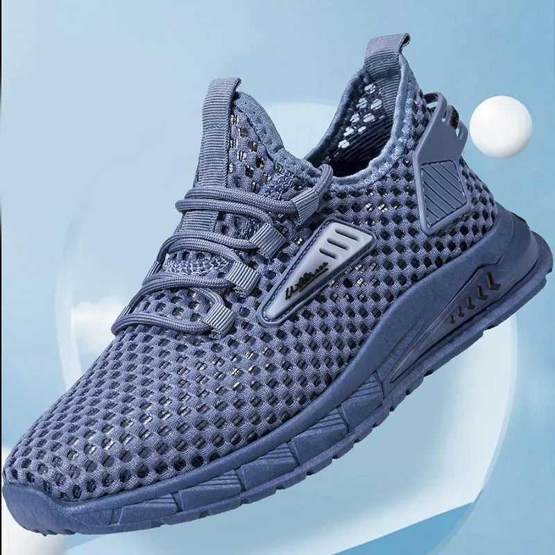 Men's beige casual sneaker with mesh lining, synthetic leather upper, and lace-up front on a low EVA sole.