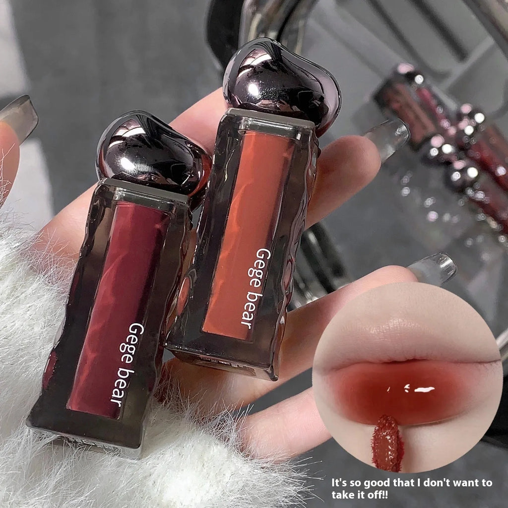 Glacier Lava Lip Lacquer in a tube showing its shiny, mirror finish with seven colour options from 01 to 07.