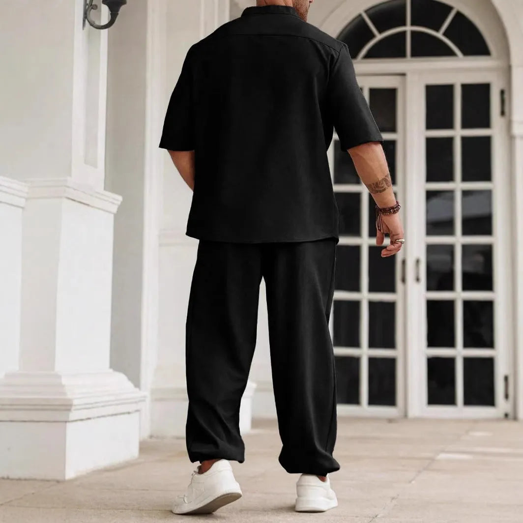Men's apricot coloured cotton linen short sleeve shirt and matching casual trousers laid flat.