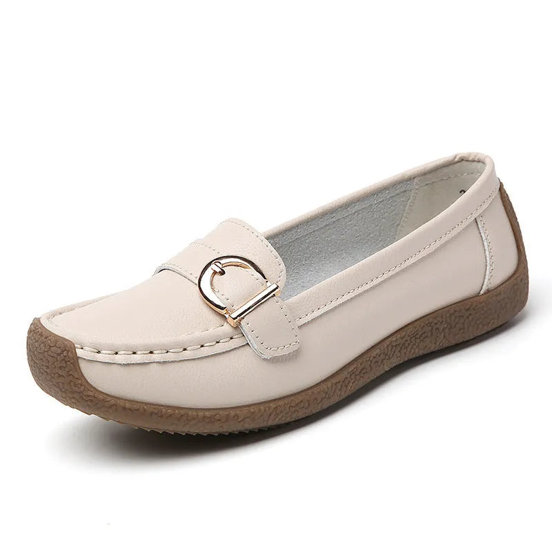 Women's beige casual loafers with a round toe and flat heel on a soft beef tendon sole.