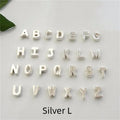 Gold and silver alloy peach heart shaped letter pendant necklace charm on a chain.