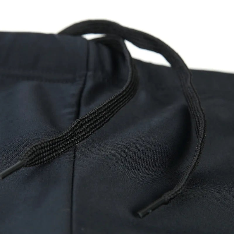 Men's plus size blue fire design boxer swimming trunks with matching swimming cap on a black background.