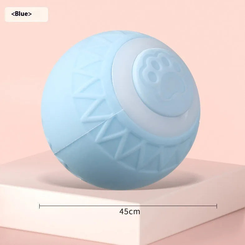 Blue automatic moving silicone ball cat toy with charging cable on hard floor