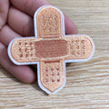 Ten computer-embroidered patch badges with adhesive backing for clothing decoration.