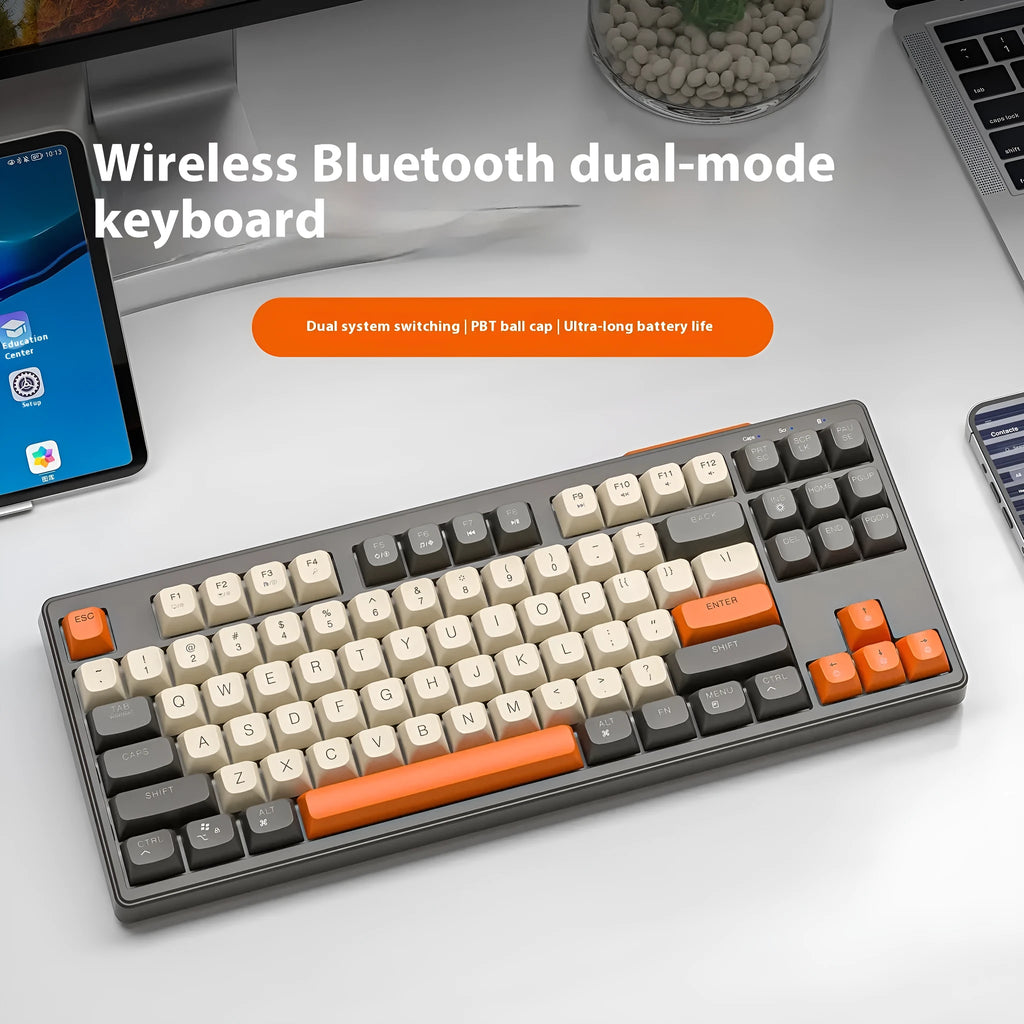 Free Wolf M87 wireless Bluetooth dual-mode keyboard in blueberry colour on a desk
