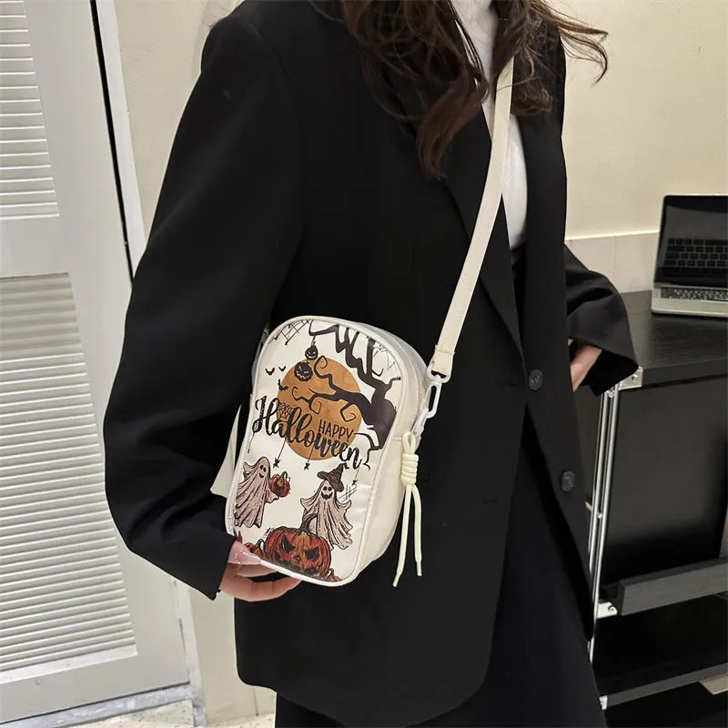 Halloween graffiti crossbody bag with pumpkin ghost bat print in black colour