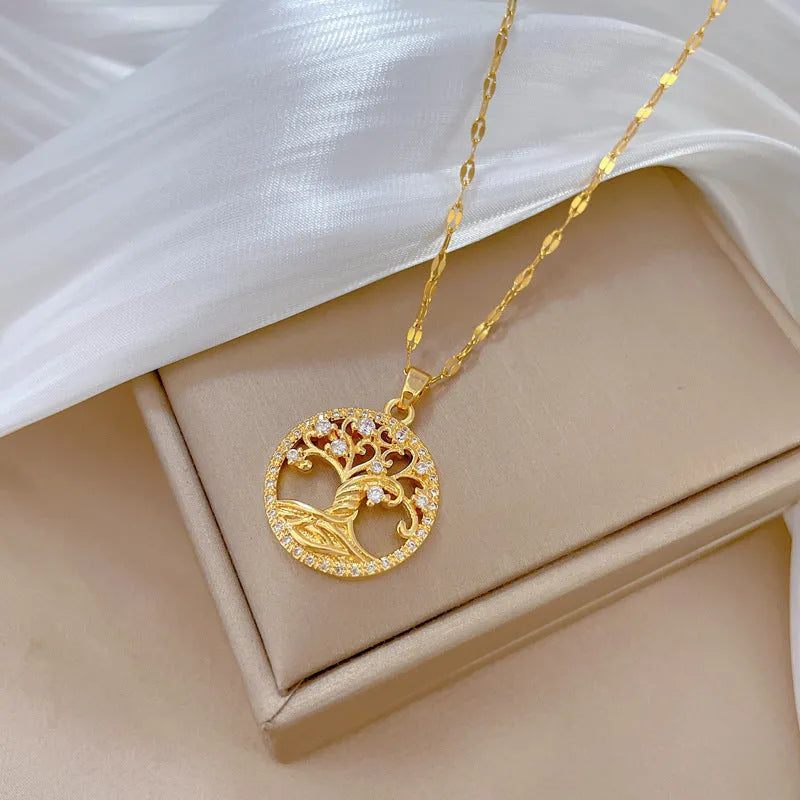 Gold-plated cross necklace with mother-of-pearl pendant and rhinestone detailing on adjustable chain