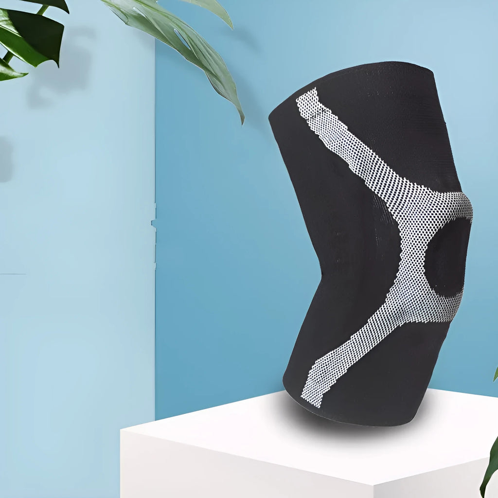 Silicone non-slip sports kneepad in grey, shown on a knee for running or climbing protection.