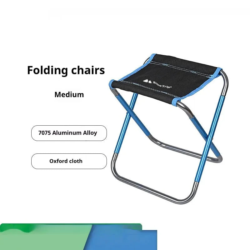 Black folding camping stool with an aluminium frame, shown in both open and folded positions.