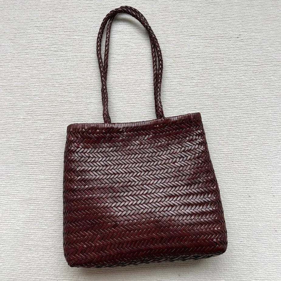 Handmade brown woven tote bag made from vintage top layer cowhide leather with a three-dimensional pocket.