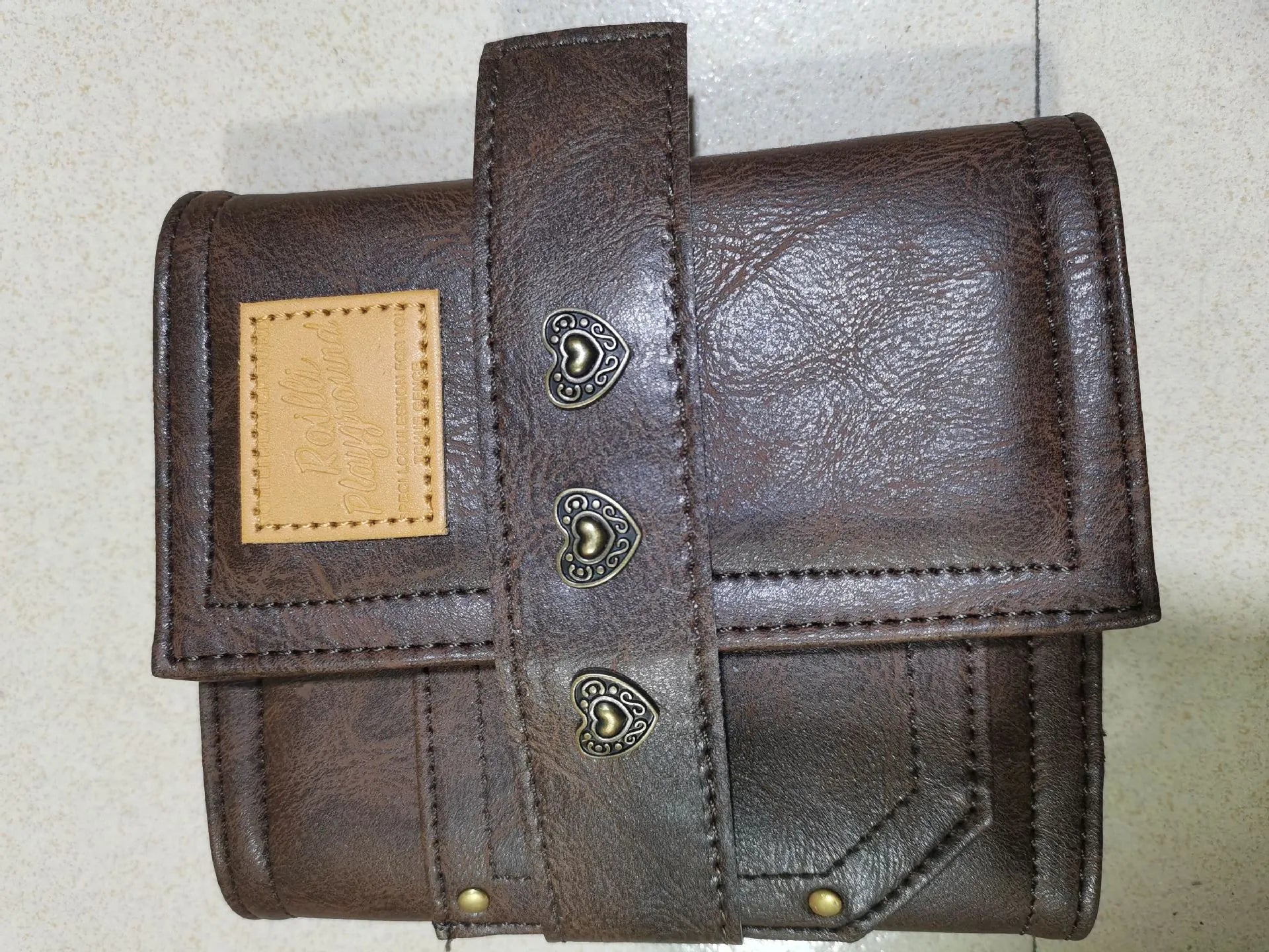 A7 brown retro leather buckle notebook with loose-leaf binding and PU cover