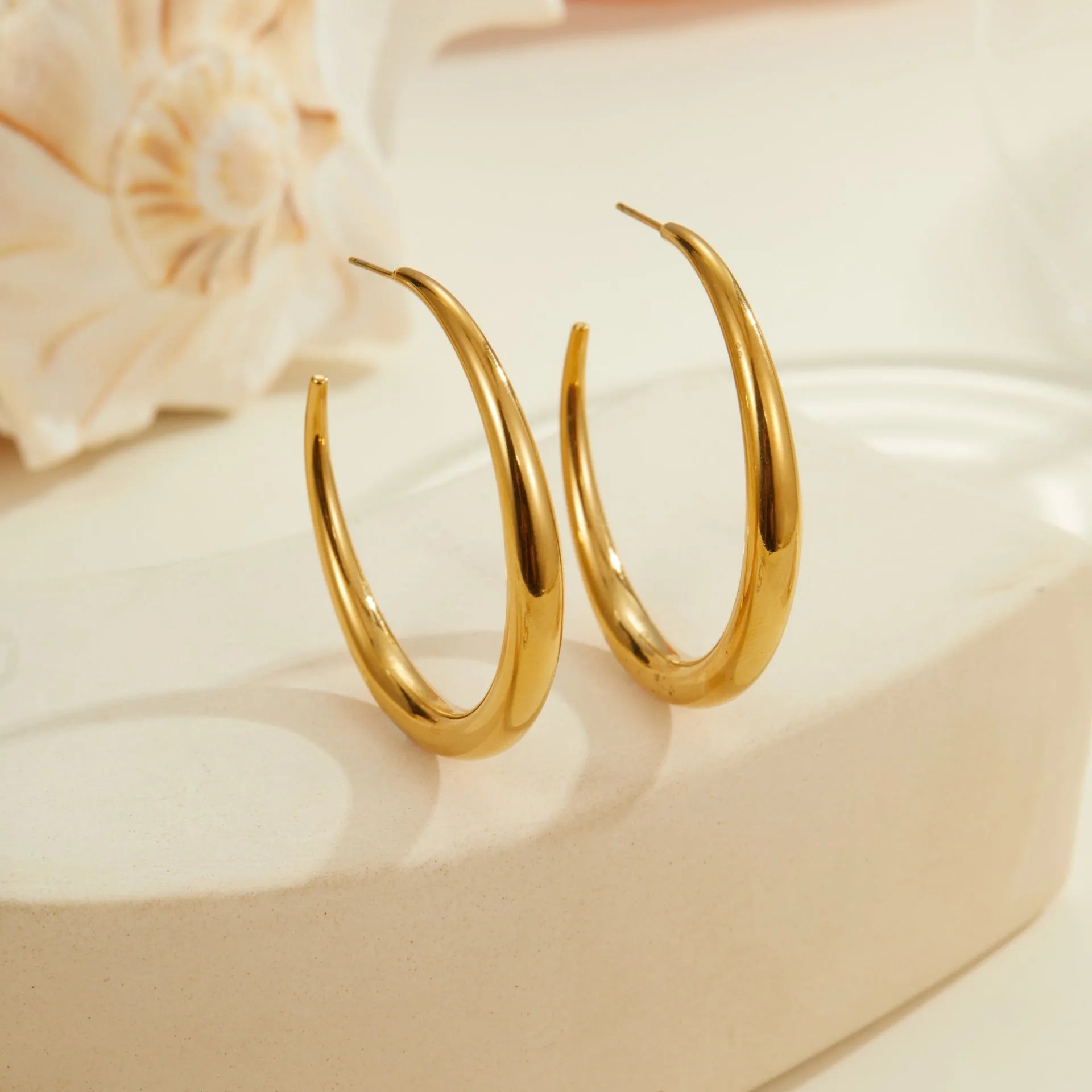 Titanium steel geometric hoop earrings with 18K gold plating in large and small sizes