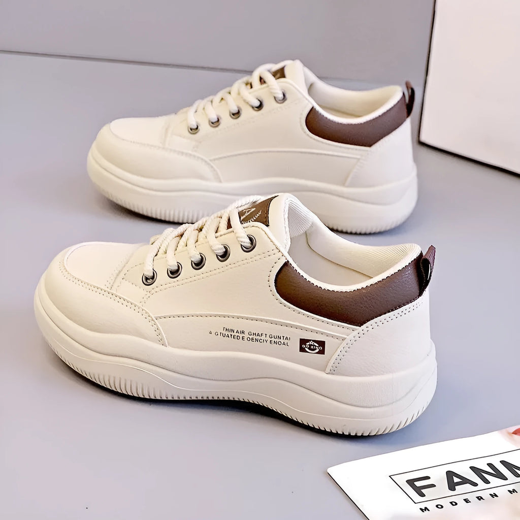 Women's white Korean style low top pumps with round head, cross straps, and rubber sole