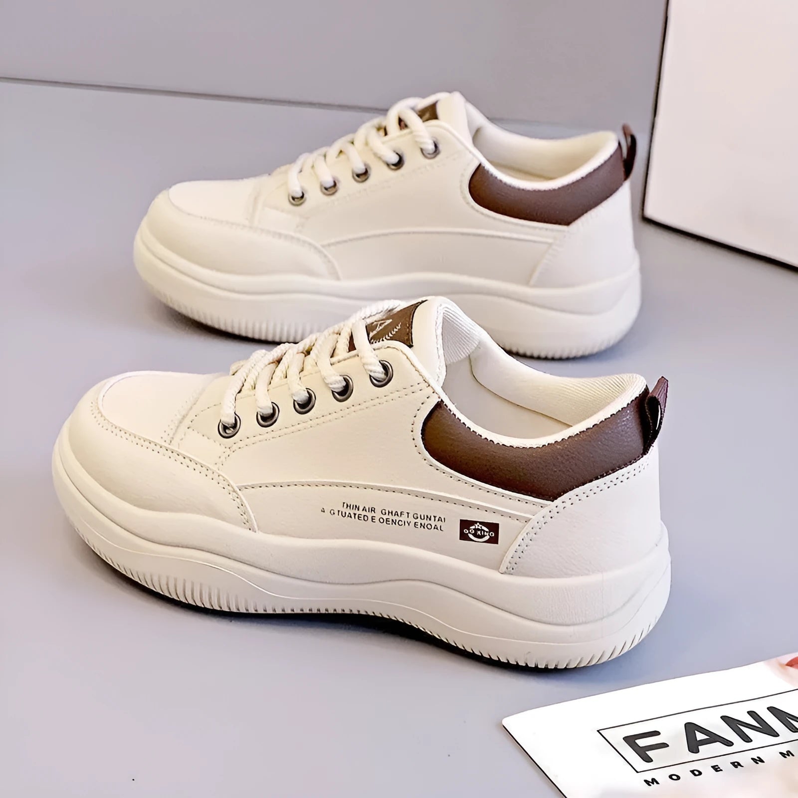 Women's white Korean style low top pumps with round head, cross straps, and rubber sole