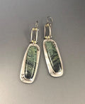 Two-colour marble pattern geometric alloy drop earrings on a white background.