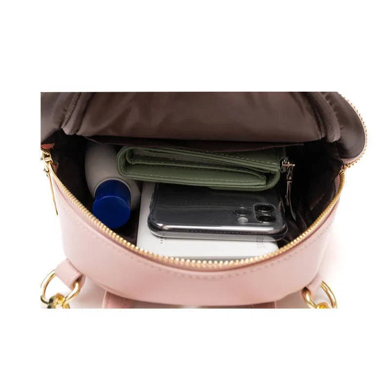 Soft PU mini backpack in street style with contrast colour detailing and three-dimensional pocket