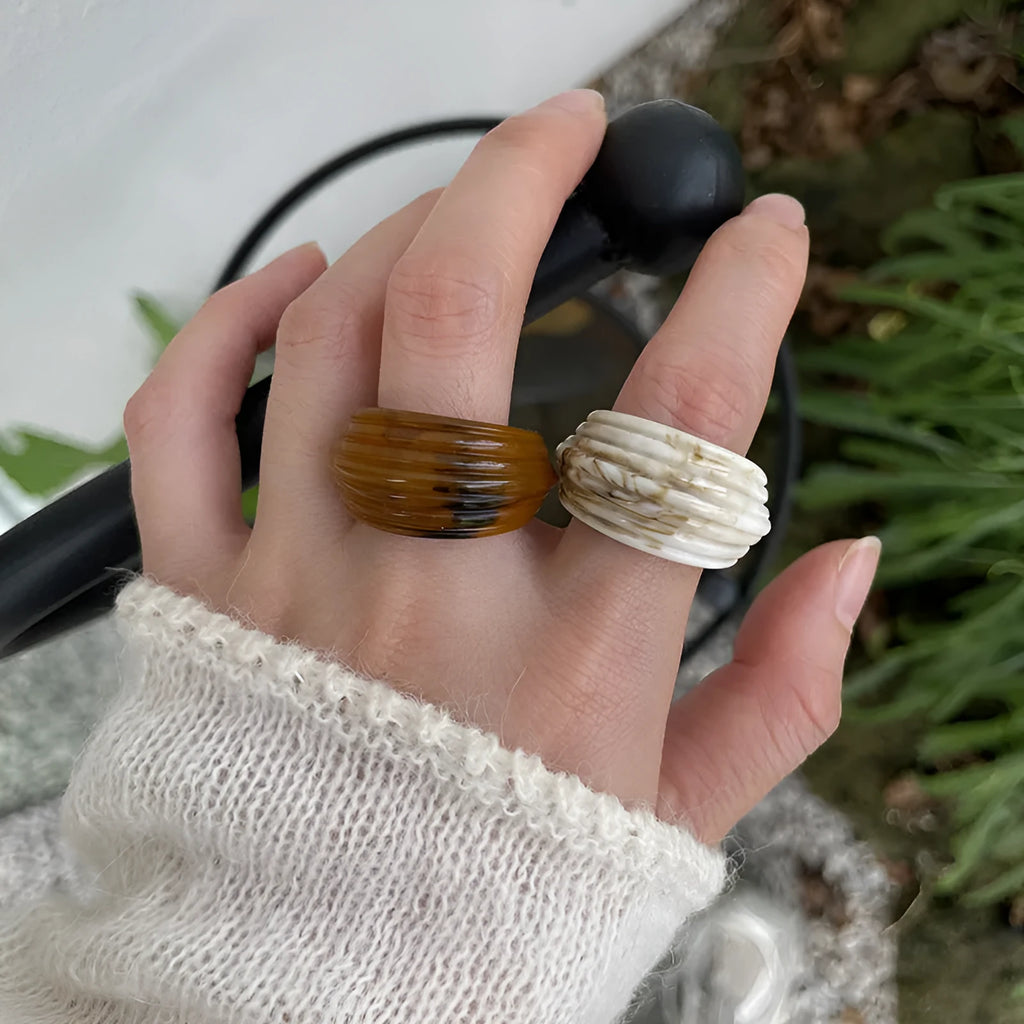 Resin ring with irregular geometric wide band design in brown and white colour options