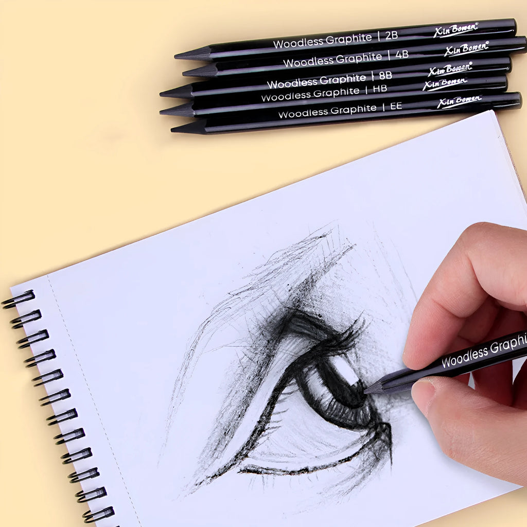 Set of wood-free graphite sketching pencils showing six different hardness grades including HB 2B 4B 6B 8B and EE