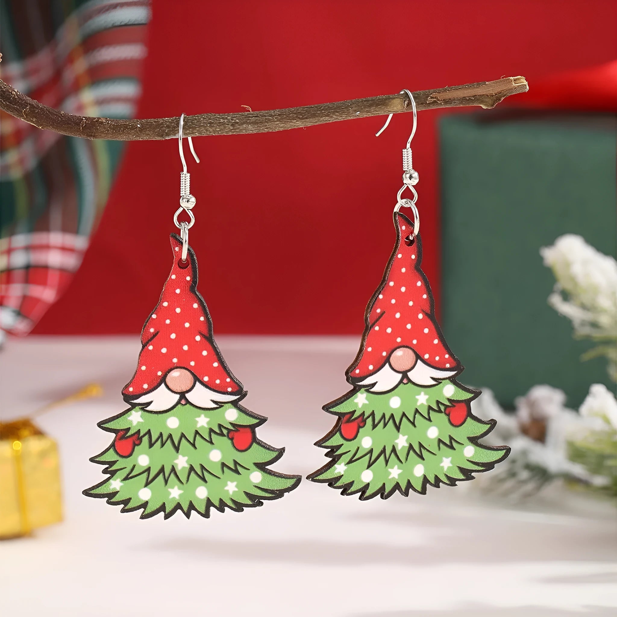 Wooden Christmas earrings with geometric shapes showing printed tree and snowman designs
