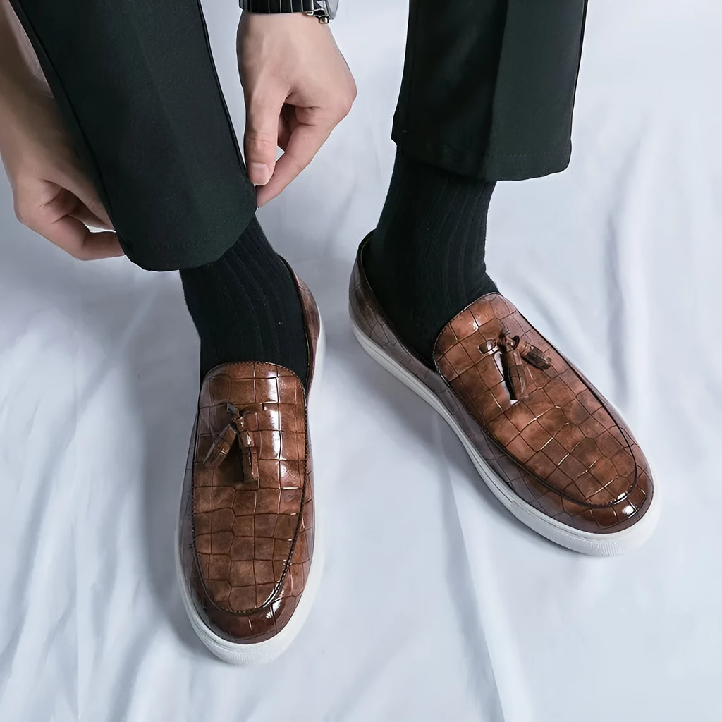 Men's black plus size casual sneakers with tassel detail on artificial PU upper and round toe.