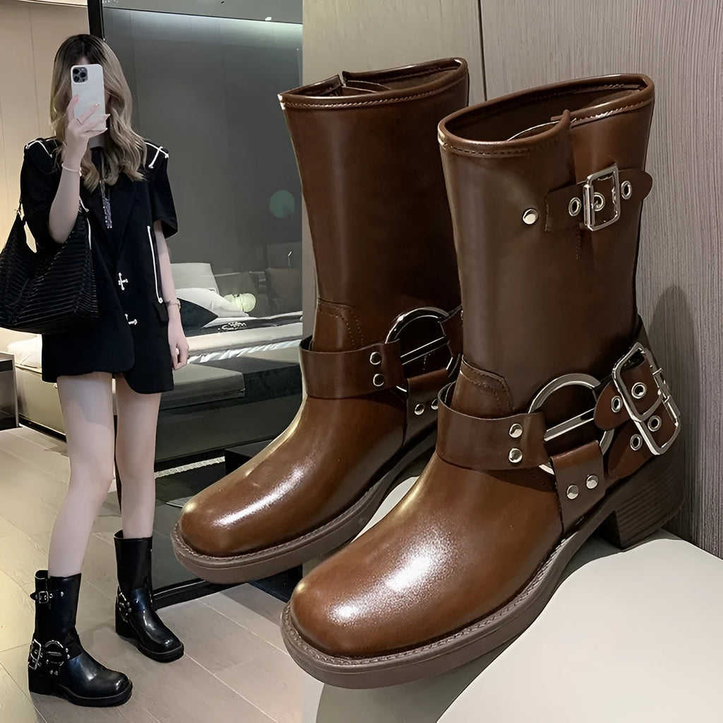 Women's black platform ankle boots with buckle detailing and mid-calf height