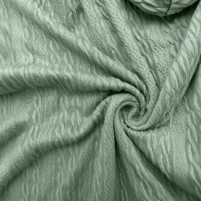 Green women's hooded sweater coat with front zipper, shown on a model in a casual setting.